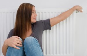 woman-by-heater-boiler-arm