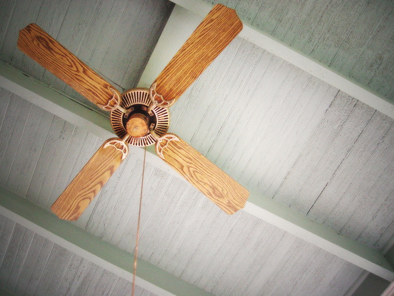 brown-wooden-ceiling-fan-on-grey-ceiling