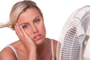 woman-sitting-in-front-of-fan