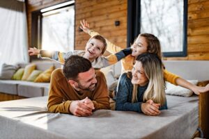 family-playing-around-on-couch