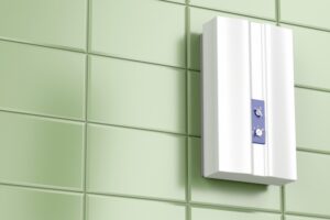 tankless-system-on-green-tiled-wall